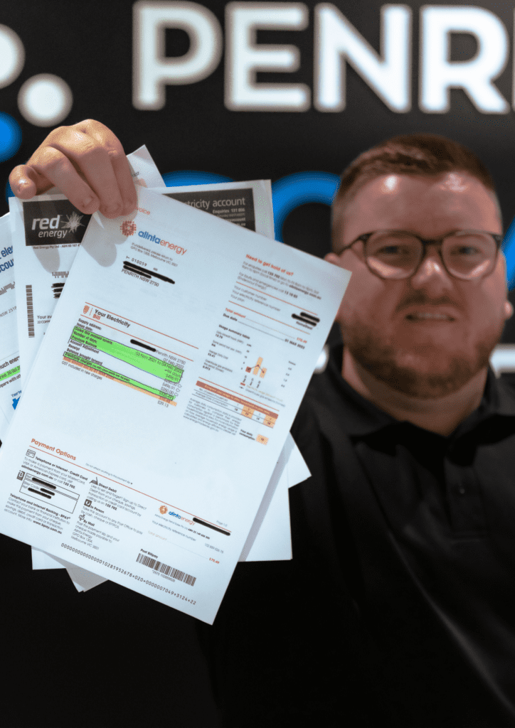 A man holding up a sheet of paper.