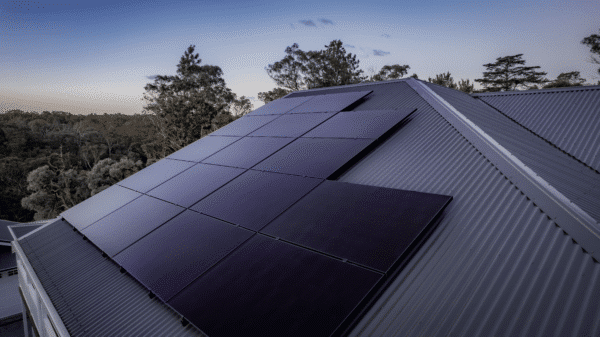 Solar panels on house at sunset.