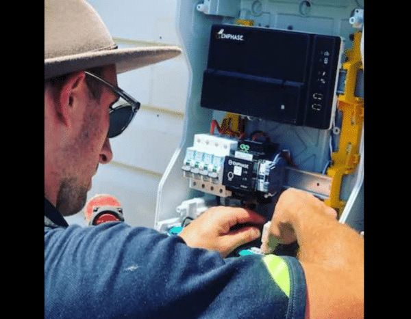 Electrician installing or servicing solar energy equipment.