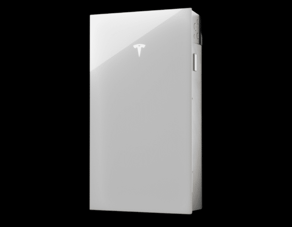 A sleek, white rectangular device with a Tesla logo on the front, resembling a battery or power storage unit, against a black background.