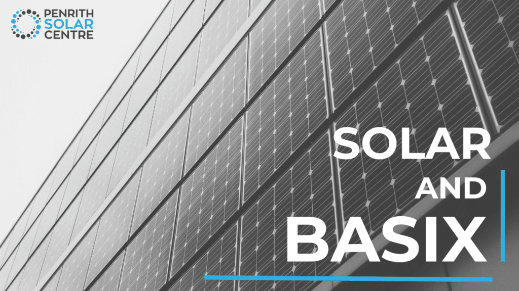 Close-up of solar panels on a building with the text "solar and basix" and the logo "penrith solar centre" in the top left corner.